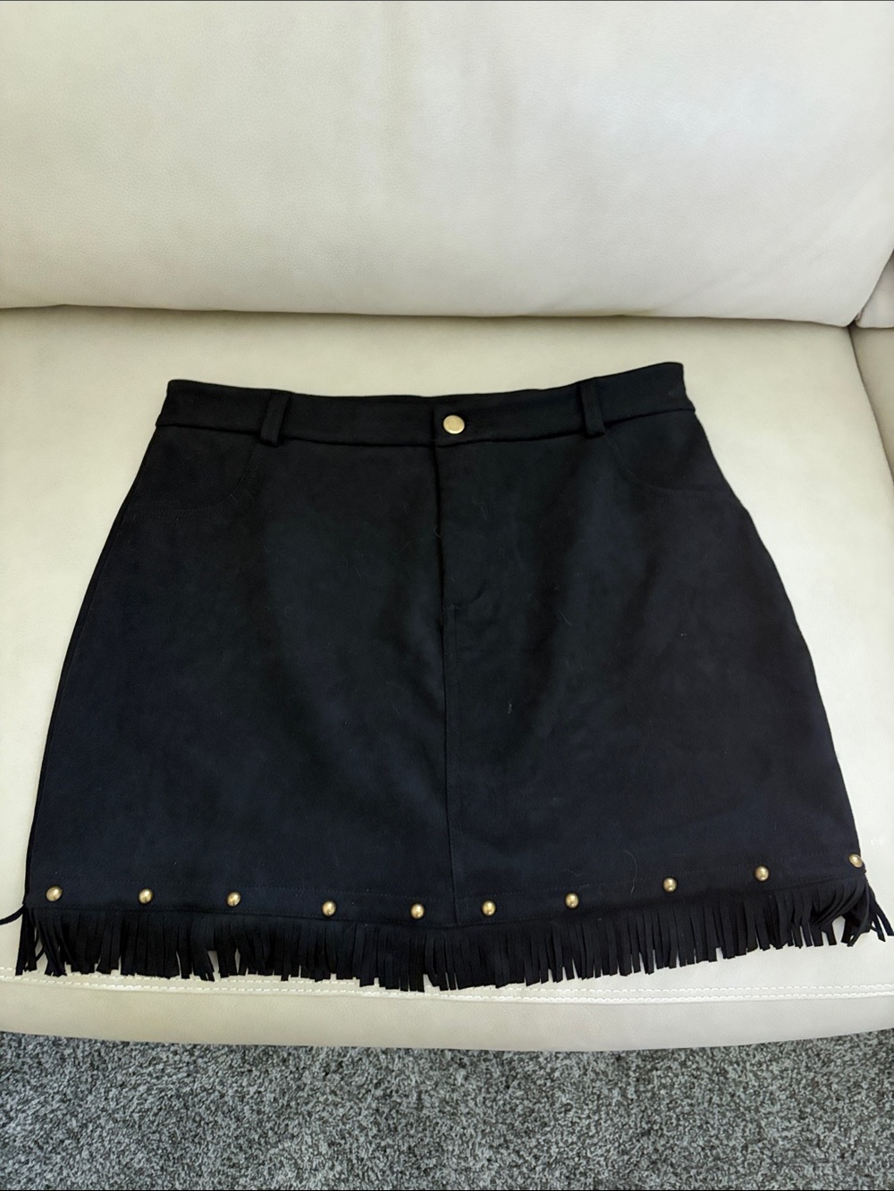 Women’s suede skirt with fringe and bronz accents